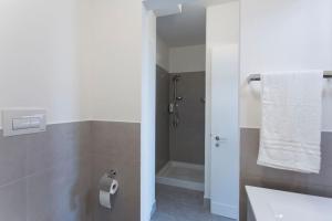 a bathroom with a toilet and a sink and a shower at Mondello Addaura Home Holiday in Mondello +44 photos