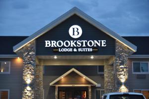 a building with a sign that reads brookside lodge and suites at Brookstone Lodge & Suites in Algona