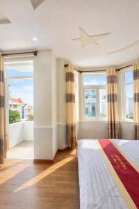 En eller flere senge i et værelse på Tiến Đạt Hotel Vũng Tàu