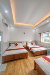 En eller flere senge i et værelse på Tiến Đạt Hotel Vũng Tàu
