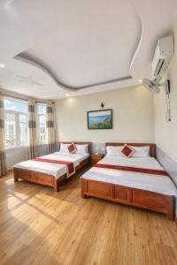 En eller flere senge i et værelse på Tiến Đạt Hotel Vũng Tàu + 24 billeder