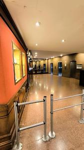 a large empty room with a railing in a building at Amazing View Studio Obelisco in La Porteña