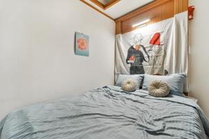 Postel nebo postele na pokoji v ubytování MIIN Stay02