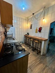 Køkken eller tekøkken på BLUE HOUSE CONEXÃO ILHA GRANDE