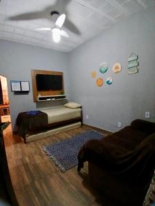 Et tv og/eller underholdning på BLUE HOUSE CONEXÃO ILHA GRANDE