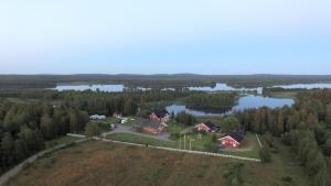 an aerial view of a house and a lake at Holiday Village Kuukiuru in Vuostimo