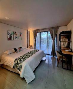 En eller flere senge i et værelse på Selvático Costa Rica