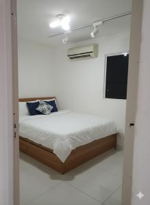 En eller flere senge i et værelse på Casa Completa Próximo ao Aeroporto de Maceió