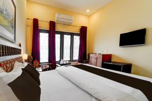 TV/trung tâm giải trí tại Super Collection O Kangarappady Formerly Cochin Residency