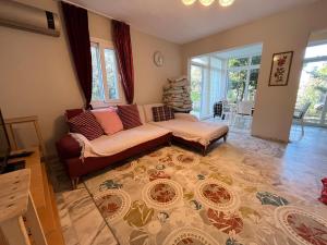 a living room with a couch and a table at Villa with private pool in Alaçatı in Ilıca +43 photos