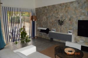 TV a/nebo společenská místnost v ubytování 10 min from Futuroscope, contemporary villa!