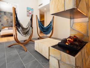 two hammocks in a living room with a fireplace at -new-SHELL THE THIRD in Kamakura