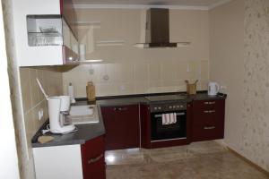 A kitchen or kitchenette at Posthotel