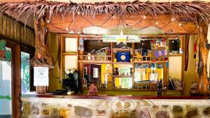 a bar in a restaurant with a counter top at Sumatra Cheeky Monkeys in Bukit Lawang +110 photos