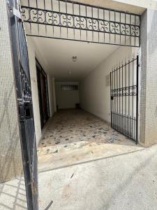 an open door of a building with a tile floor at Casa para até 8 pessoas perto da Basílica in Aparecida