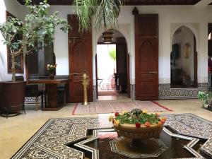 a room with a bowl of vegetables on the floor at Riad Viva in Marrakesh