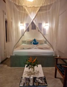 En eller flere senge i et værelse på Avalon Villa Unawatuna