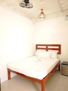 Postel nebo postele na pokoji v ubytování Moalboal Seaside Resort