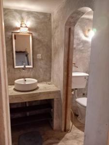 a bathroom with a sink and a toilet and a mirror at Avalon Villa Unawatuna in Unawatuna +37 photos