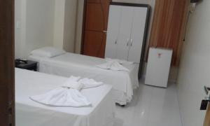 Postel nebo postele na pokoji v ubytování Hotel Columbia