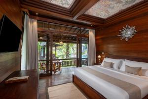 Postel nebo postele na pokoji v ubytování Emana Abian Taksu + 20 fotografií