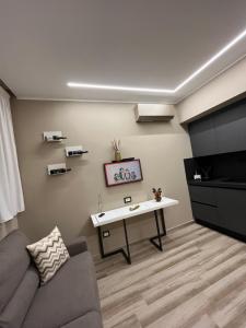 a living room with a couch and a table at Omero in Reggio di Calabria