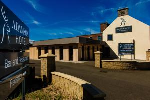 a building with street signs in front of it at Adamson Hotel in Dunfermline