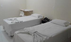 Postel nebo postele na pokoji v ubytování Hotel Columbia