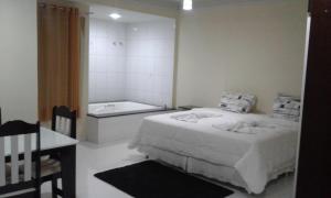 Postel nebo postele na pokoji v ubytování Hotel Columbia