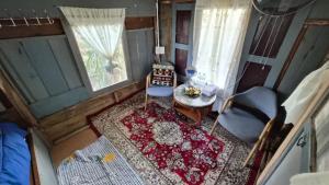 an overhead view of a living room with a table and a chair at Faiza Farm home in Ban Nong Phai