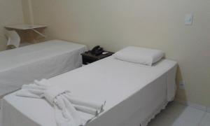 Postel nebo postele na pokoji v ubytování Hotel Columbia