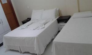 Postel nebo postele na pokoji v ubytování Hotel Columbia