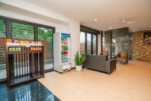 a lobby of a store with a waiting room at Pink Residence Chalong in Ban Bang Chak