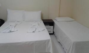 Postel nebo postele na pokoji v ubytování Hotel Columbia