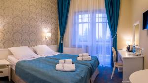 Postel nebo postele na pokoji v ubytování Dom Zdrojowy + 26 fotografií