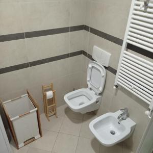 a bathroom with a toilet and a sink at AdryHouse in Grado