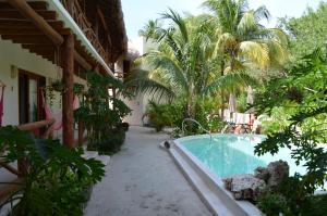 Bazén v ubytování Casa Iguana Holbox - Beachfront Hotel nebo v jeho okolí