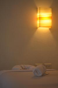 Postel nebo postele na pokoji v ubytování Casa Iguana Holbox - Beachfront Hotel