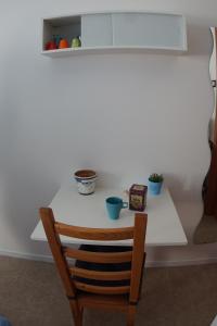 a table with a chair and two cups on it at Agriturismo Sila in Termoli