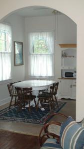 a dining room with a table and chairs at First floor, 2 bedrm 2 bath, sleeps 6, Parking available, walk to Beach & Shop in Cape May