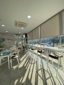 a dining room with tables and chairs in a building at No25 Hotels in Çorlu