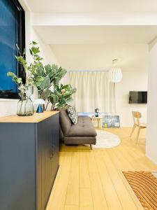 a living room with a couch and a table at Kyo-wa Hotel Kinshicho in Tokyo