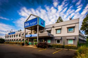 a large building with a sign on the side of it at ibis Budget Wentworthville in Wentworthville