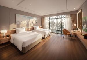 Giường trong phòng chung tại Anyla Grand Hotels