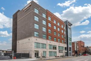 a building on the corner of a street at Cambria Hotel Louisville Downtown-Whiskey Row in Louisville