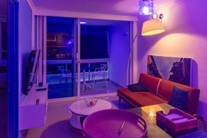 a living room with a couch and a table at Balcony to the Horizon in Cartagena de Indias
