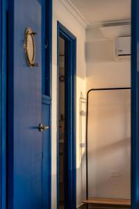 a blue door with a mirror in a room at Balcony to the Horizon in Cartagena de Indias +26 photos