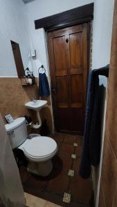 a bathroom with a toilet and a sink at Refugio de las Estrellas in Antigua Guatemala