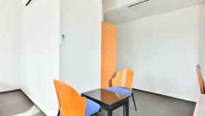 a meeting room with chairs and a table at First Inn Haiki in Sasebo +9 photos