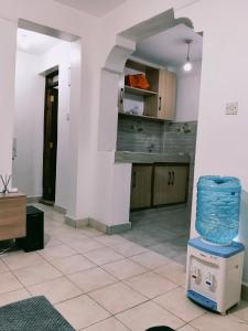 a room with a kitchen with a counter top at Kinara suites in Kiambu
